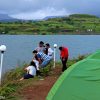 group of tent sitting near lake