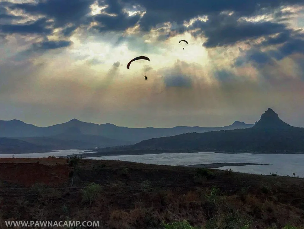 paragliding at pawna lake - paragliding in the air