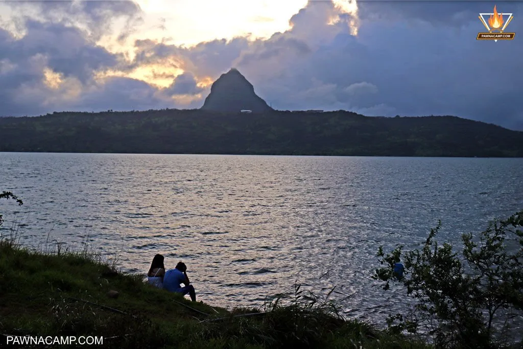 Couple sitting near pawna lake