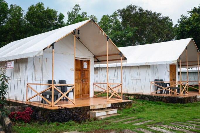Deluxe cottages at Pawna Lake, offering scenic lakeview stays amidst lush greenery for a serene getaway experience.